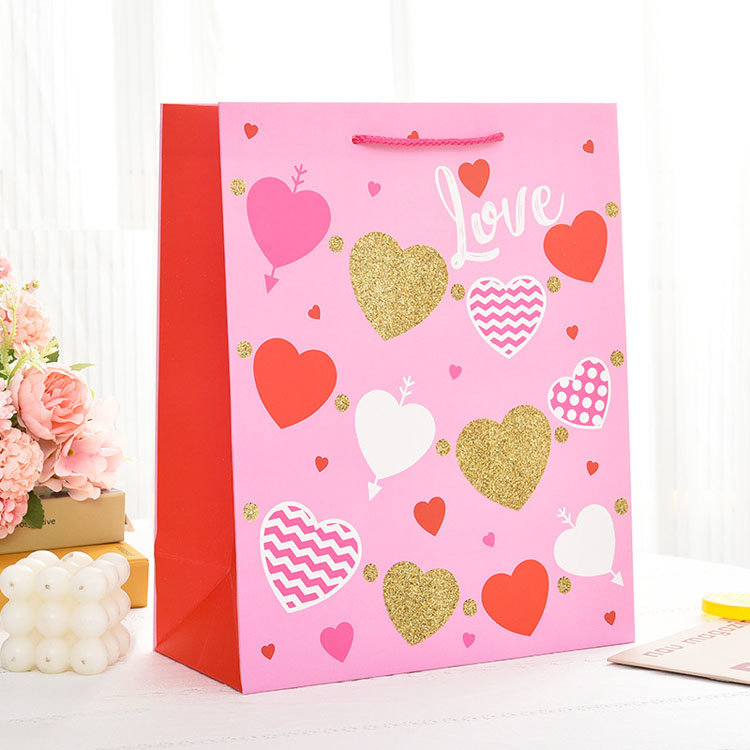 Bolsa de papel de regalo de logotipo personalizado de marca de lujo para ropa Pink Matte Garming Clothing Boutique Bolsas con mangos de cinta